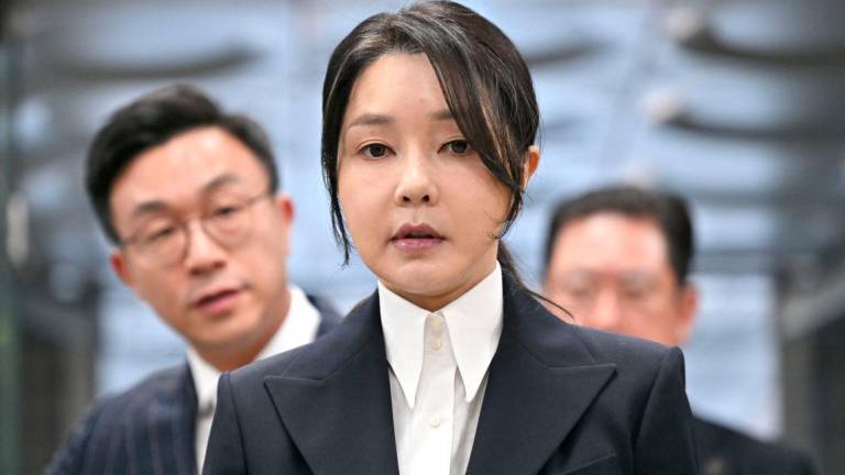 South Korea's former first lady Kim Keon Hee, wife of impeached former president Yoon Suk Yeol, arrives at a court to attend a hearing to review her arrest warrant requested by special prosecutors at the Seoul Central District Court, in Seoul, South Korea August 12, 2025. - Jung Yeon-je/Pool via REUTERSPIX