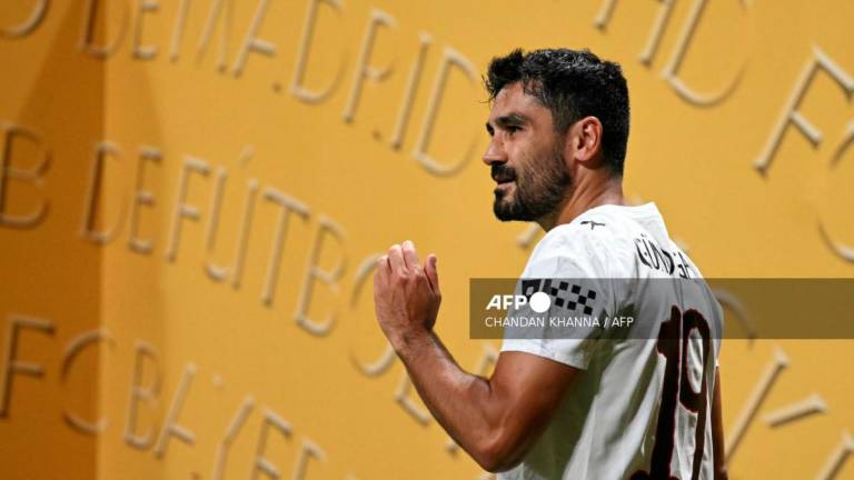 Manchester City's German midfielder #19 Ilkay Gundogan gestures during the FIFA Club World Cup 2025 Group G football match between England's Manchester City and UAE's Al Ain FC at the Mercedes-Benz stadium in Atlanta on June 22, 2025. - AFPPIX