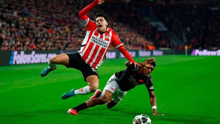 PSV Eindhoven’s Richard Ledezma in action with Arsenal’s Myles Lewis-Skelly. REUTERS Pix