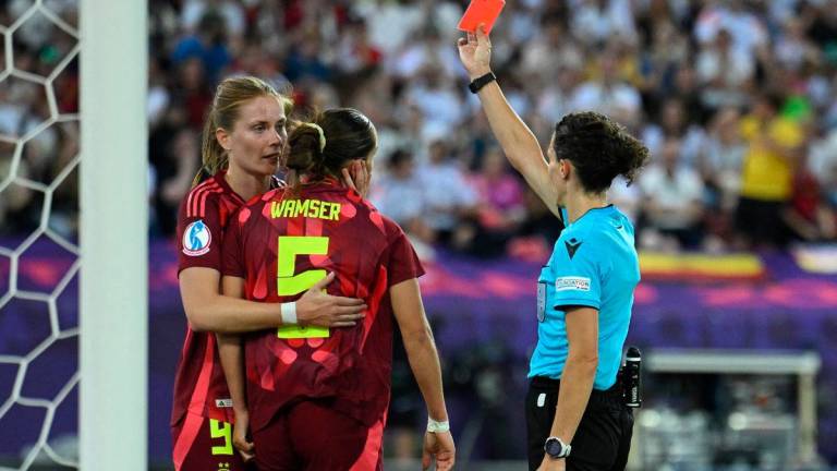 Germany’s Carlotta Wamser is shown a red card by referee Silvia Gasperotti REUTERS