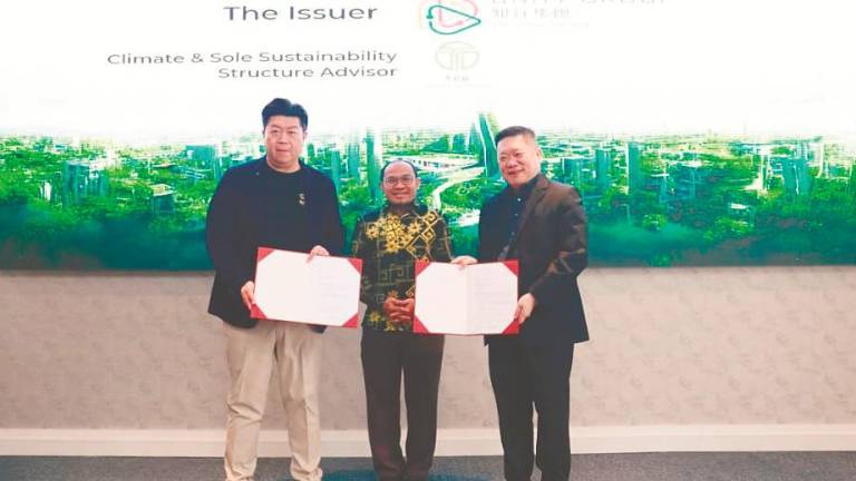 From left: Wong, Labuan Financial Services Authority director-general Affendi Rashdi and H’ng during an exchange of engagement letters ceremony at the launch.