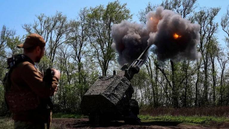 FILEpix: A serviceman of the 43rd Hetman Taras Triasylo Separate Artillery Brigade of the Ukrainian Armed Forces stands near an Archer self-propelled howitzer as it is fired towards Russian troops, amid Russia’s attack on Ukraine, at a position in Zaporizhzhia region, Ukraine April 24, 2025. REUTERSpix