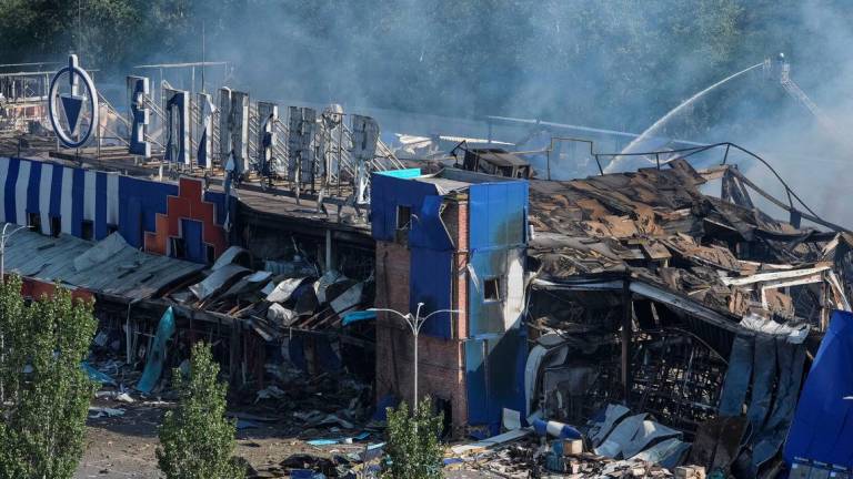 A firefighter works at the site of a household item shopping mall which was hit by a Russian missile strike, amid Russia's attack on Ukraine, in the city of Kamianske, Dnipro region, Ukraine July 26, 2025. - REUTERSPIX