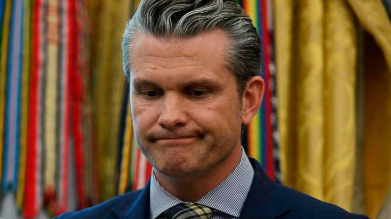 US Secretary of Defense Pete Hegseth looks on as US President Donald Trump (unseen) speaks in the Oval Office of the White House on May 20, 2025, in Washington, DC. Trump is expected to make an announcement about the Golden Dome missile defense shield. AFPpix