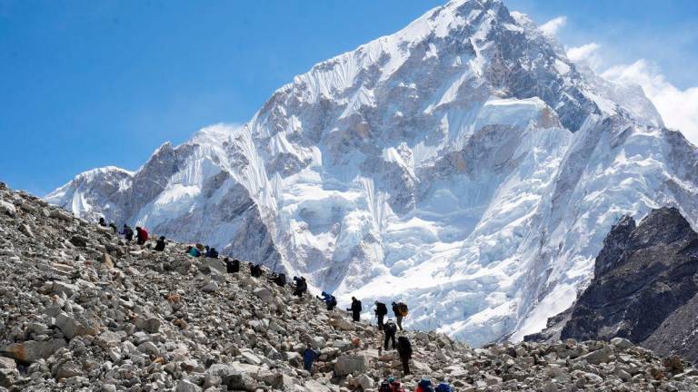 FILE PHOTO: Mountaineers and trekkers head towards the Everest base camp from Lobuche in the Solukhumbu district, also known as the Everest region, Nepal April 12, 2025. REUTERS/Purnima Shrestha/File Photo