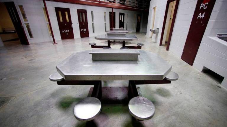 The interior of an unoccupied communal cellblock is seen at Camp VI, a prison used to house detainees at the U.S. Naval Base at Guantanamo Bay. Reuters