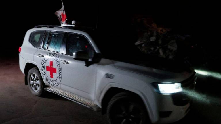 A Red Cross vehicle transports the bodies of hostages who were held in Gaza since the deadly October 7, 2023, attack, after they were handed over by Hamas militants as part of a ceasefire and a hostage-prisoner swap deal between Hamas and Israel, in Gaza City, October 15, 2025. - REUTERSPIX