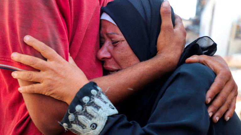 A mourner reacts during the funeral of Palestinians who, according to medics, were killed in overnight Israeli strikes on homes at Shati (Beach) refugee camp, amid an Israeli military operation, at Al-Shifa hospital in Gaza City, September 26, 2025. - REUTERSPIX