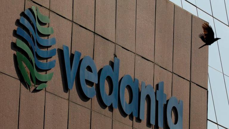 FILE PHOTO: A bird flies past the logo of Vedanta installed on the facade of its headquarters in Mumbai, India January 31, 2018. REUTERS/Danish Siddiqui/File Photo