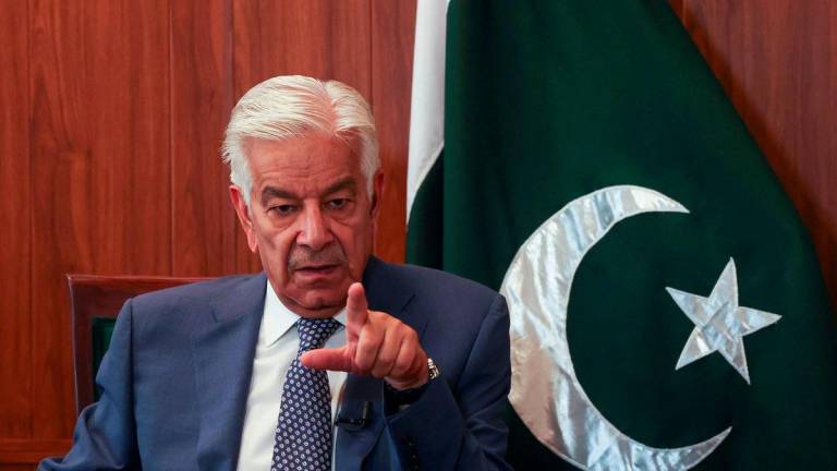 Pakistan's Defence Minister Khawaja Muhammad Asif gestures during an interview with Reuters in Islamabad, Pakistan, May 8, 2025. REUTERS/Fayaz Aziz