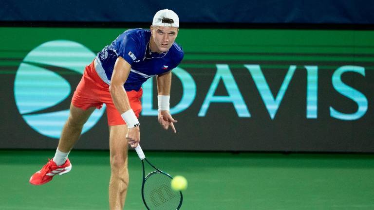 Jakub Mensik of Czechia serves the ball against Taylor Fritz of the United States in the second rubber of the Davis Cup tie between the USA and Czechia at Delray Beach Tennis Center. - Mullane-Imagn Images