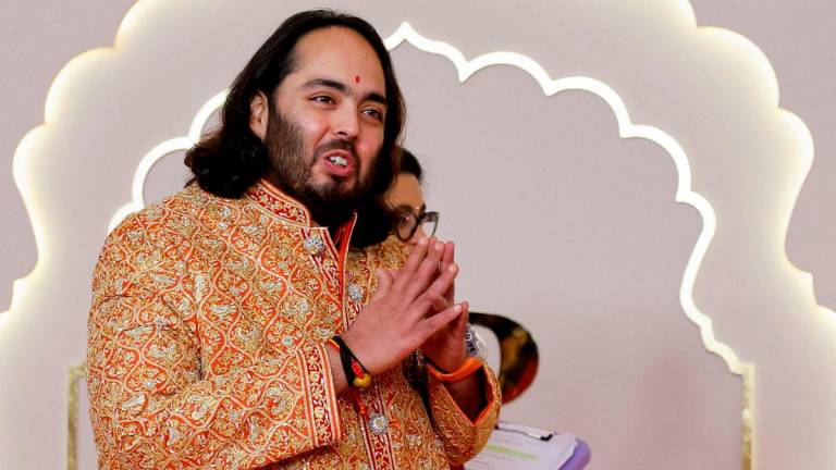 Anant Ambani gestures on the day of his wedding with Radhika Merchant in Mumbai, India, July 12, 2024. REUTERS/Francis Mascarenhas