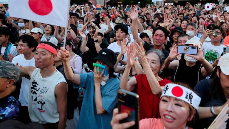 Supporters of Japan's Sanseito party leader react during the party’s rally in Tokyo, Japan, July 21, 2025, a day after the upper house election. - REUTERSPIX