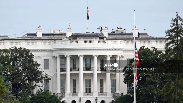 Flags are seen at half staff in front of the White House in Washington, DC on September 11, 2025. (Photo by ANDREW CABALLERO-REYNOLDS / AFP)