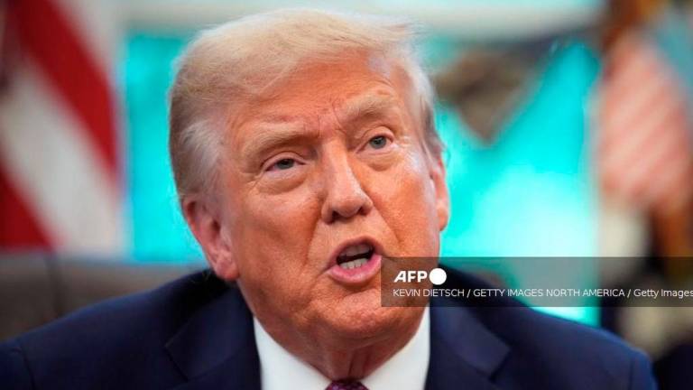 U.S. President Donald Trump speaks to members of the media as he signs executive orders during a press availability in the Oval Office of the White House on September 05, 2025 in Washington, DC. - Getty Images via AFP