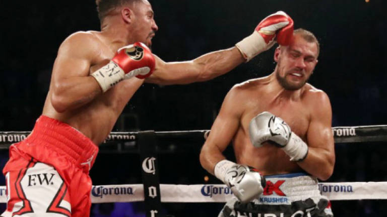 Ward stuns Kovalev in rematch to retain three titles