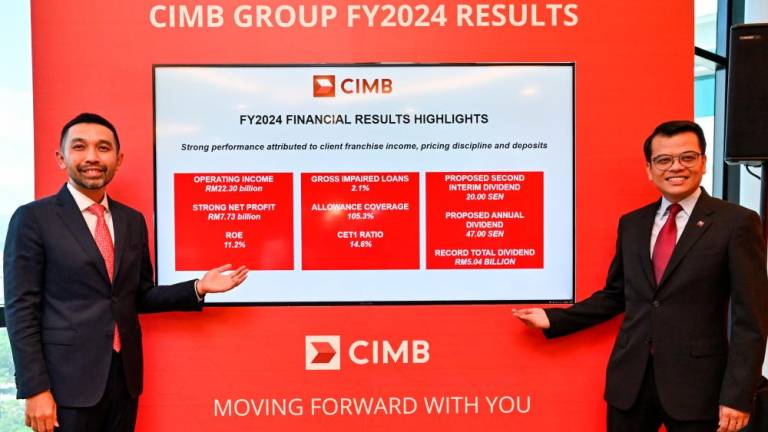 Novan (left) and CIMB Group chief financial and strategy officer Khairul Rifaie at a press conference on the banking group’s FY24 financial results.