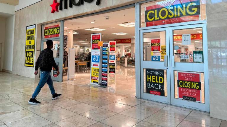 A customer enters a Macy's store that is set to close at Bay Fair Mall in San Leandro, California, on Tuesday. – AFPpic