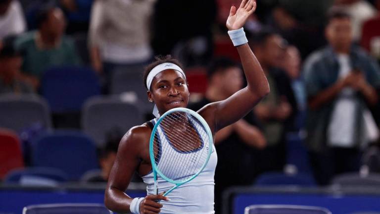 Tennis - WTA 1000 - Wuhan Open - Optics Valley International Tennis Center, Wuhan, China - October 11, 2025 Coco Gauff of the U.S. celebrates winning her semi final match against Italy's Jasmine Paolini - REUTERSPIX