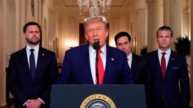 US President Donald Trump addresses the nation, alongside US Vice President JD Vance (L), US Secretary of State Marco Rubio (2nd R) and US Secretary of Defense Pete Hegseth (R), from the White House in Washington, DC on June 21, 2025, following the announcement that the US bombed nuclear sites in Iran. President Donald Trump said June 21, 2025 the US military has carried out a “very successful attack” on three Iranian nuclear sites, including the underground uranium enrichment facility at Fordo. “We have completed our very successful attack on the three Nuclear sites in Iran, including Fordow, Natanz, and Esfahan,“ Trump said in a post on his Truth Social platform. - CARLOS BARRIA / POOL / AFP