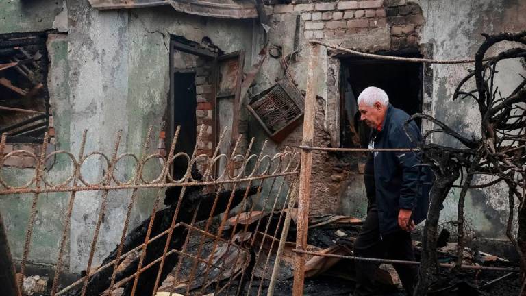 A resident walks near his house destroyed by a Russian drone strike, amid Russia’s attack on Ukraine, in the city of Chornomorsk, Odesa region, Ukraine October 9, 2025. REUTERS/Nina Liashonok