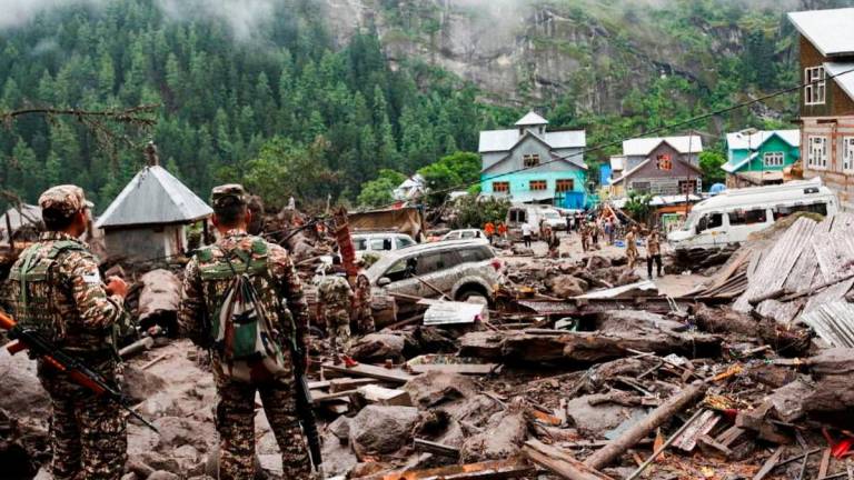 Members of Indian Army work at an area affected by the deadly flood caused by sudden, heavy rain in Chasoti town of Kishtwar district, Indian Kashmir, August 15, 2025. REUTERS/Stringer