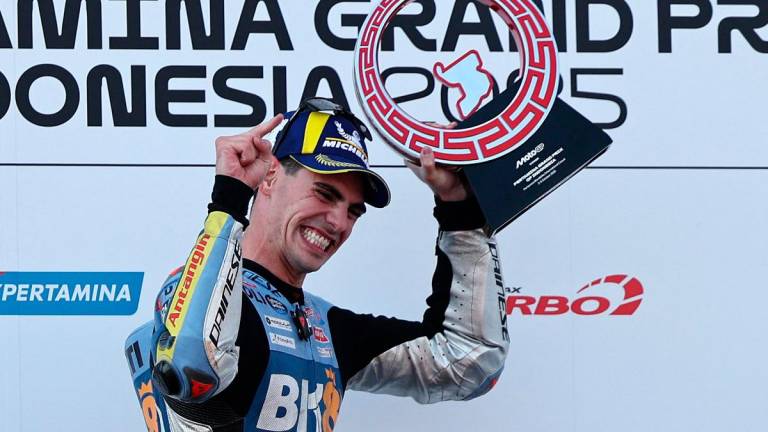 Fermin Aldeguer celebrates on the podium after winning the MotoGP race. - REUTERS/Willy Kurniawan
