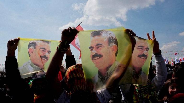 Supporters of the pro-Kurdish Peoples’ Equality and Democracy Party (DEM Party) display flags with a portrait of jailed Kurdistan Workers Party (PKK) leader Abdullah Ocalan, in Istanbul, Turkey, March 17, 2024. REUTERS/Umit Bektas/File Photo