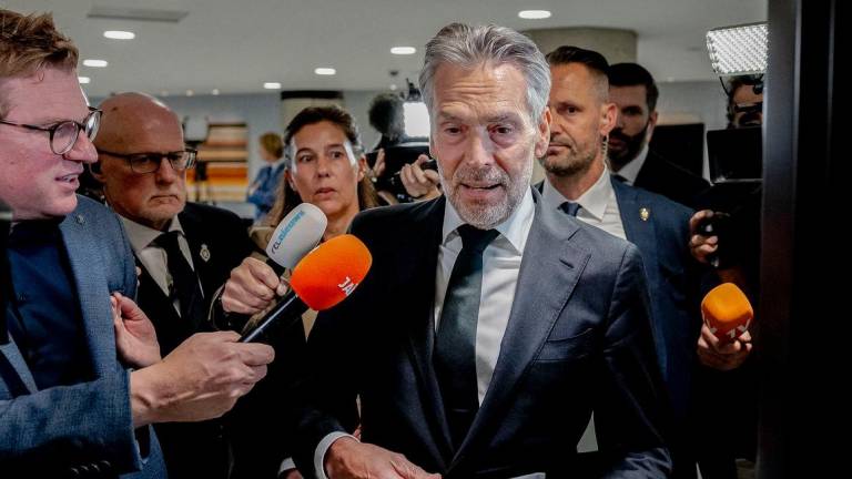 Outgoing Dutch Prime Minister Dick Schoof (C) is surrounded by media as he arrives to take part in a debate in the Lower House focused on the fall of the cabinet in The Hague, The Netherlands on June 4 2025. (Photo by Remko de Waal / ANP / AFP)