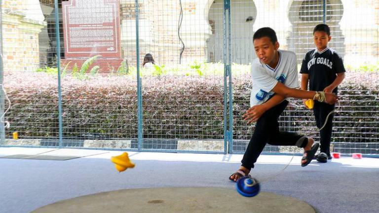 An enthusiast showing off his gasing pangkah skills - Amirul Syafiq/theSunpix