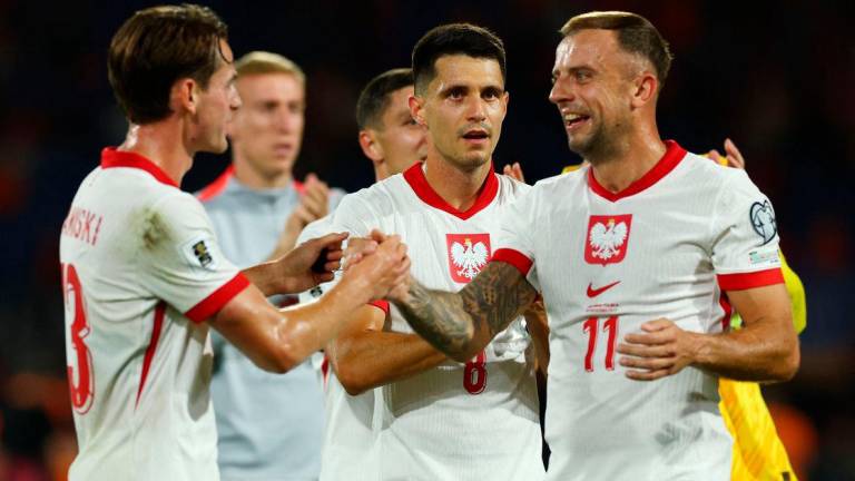 Poland’s Kamil Grosicki, Poland’s Bartosz Kapustka and Poland’s Jakub Kaminski react after the match REUTERSPix