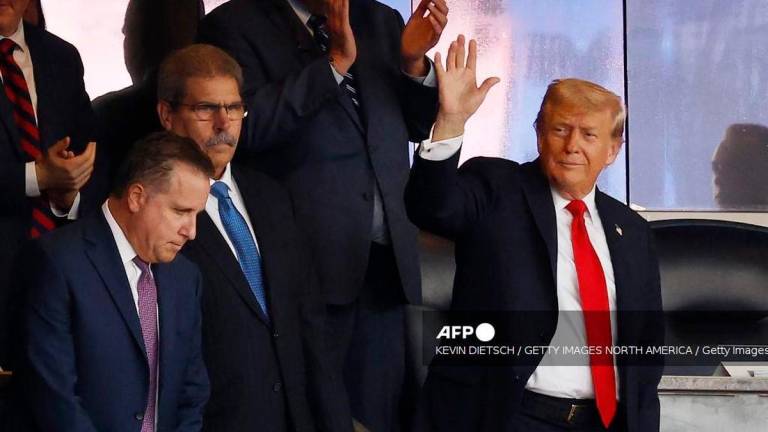 President Donald Trump (R) waves as he attends the New York Yankees game against the Detroit Tigers at Yankees Stadium on September 11, 2025 in New York City. President Trump will stay in New York at Trump Tower before heading to his golf club in Bedminster, New Jersey for the weekend. Kevin Dietsch/Getty Images/AFP (Photo by Kevin Dietsch / GETTY IMAGES NORTH AMERICA / Getty Images via AFP)