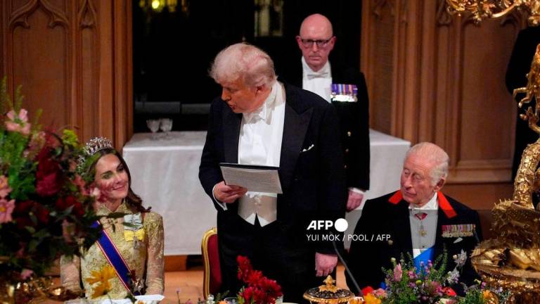 US President Donald Trump speaks to Britain’s Catherine, Princess of Wales as he delivers a speech during a State Banquet at Windsor Castle, in Windsor, on September 17, 2025, during the US President’s second State Visit. US President Donald Trump arrived in Britain for an unprecedented second State Visit, with the UK government rolling out a royal red carpet welcome to win over the mercurial leader. (Photo by Yui Mok / POOL / AFP)