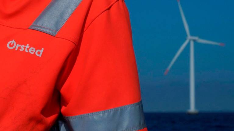 FILE PHOTO: The logo for Orsted can be seen on the jacket worn by an employee as he talks to journalists during a visit to the offshore wind farm near Nysted, Denmark, September 4, 2023. REUTERS/Tom Little/File Photo/File Photo