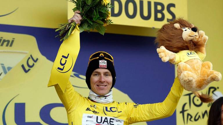 AE Team Emirates XRG’s Tadej Pogacar celebrates on the podium wearing the yellow jersey after stage 20 - REUTERS