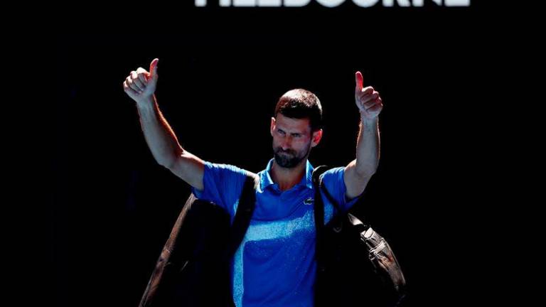 Tennis - Australian Open - Melbourne Park, Melbourne, Australia - January 24, 2025Serbia's Novak Djokovic gestures to the crowd as he leaves the court after retiring from his semi final match against Germany's Alexander Zverev - REUTERSPIX