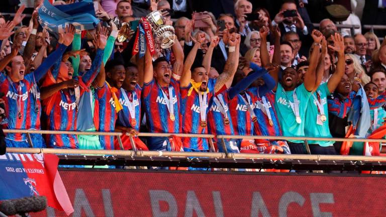 Crystal Palace’s Joel Ward and Marc Guehi celebrate with the trophy after winning the FA Cup. Reuterspix