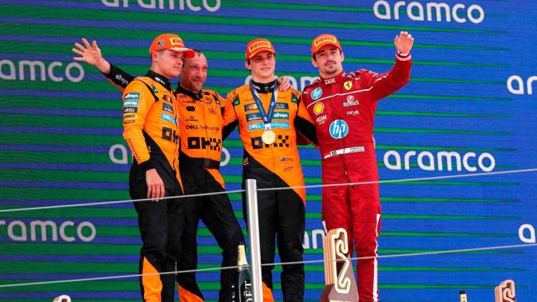 McLaren’s British driver Lando Norris (L), McLaren’s Australian driver Oscar Piastri (2R) and Ferrari’s Monegasque driver Charles Leclerc (R) celebrate on the podium after the Formula One Spanish Grand Prix at the Circuit de Catalunya in Montmelo, on the outskirts of Barcelona, on June 1, 2025. AFPpix
