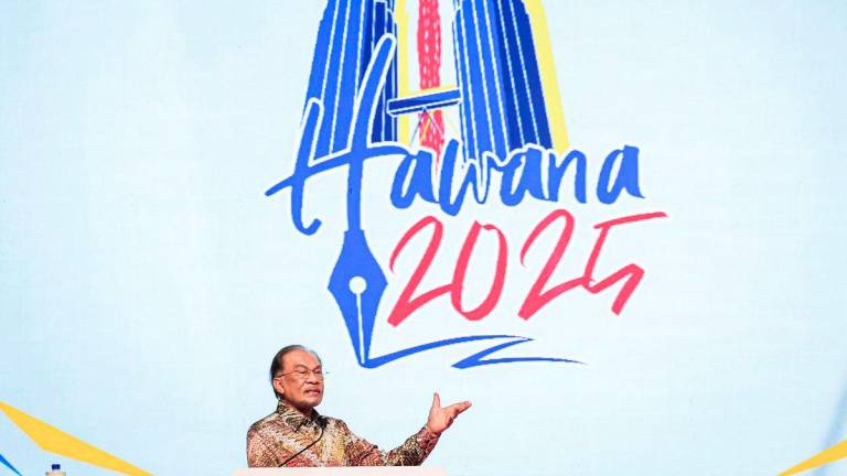 Prime Minister Datuk Seri Anwar Ibrahim delivers a speech during the officiation of the National Journalists’ Day (HAWANA) 2025 celebration at the World Trade Centre Kuala Lumpur (WTCKL) today. - BERNAMAPIX