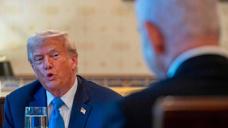 US President Donald Trump meets with Israeli Prime Minister Benjamin Netanyahu (R) at the Blue Room of the White House in Washington, DC, on July 7, 2025. (Photo by ANDREW CABALLERO-REYNOLDS / AFP)