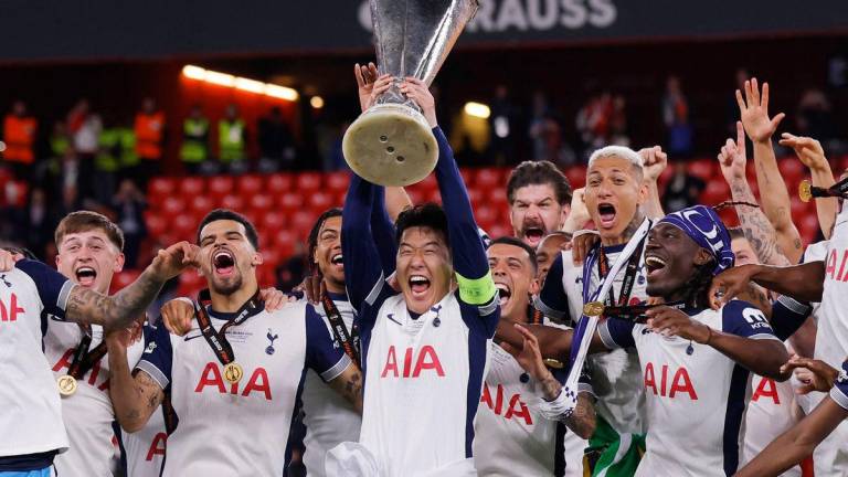 Tottenham Hotspur’s Son Heung-min lifts the trophy with teammates after winning the Europa League Final REUTERSpix