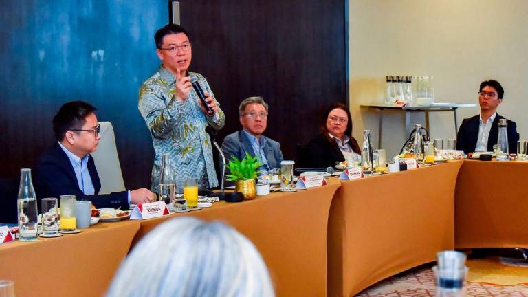 Minister of Housing and Local Government, Nga Kor Ming speaks with media representative during the Build the Nation: Urban Renewal and Housing Reforms session at a hotel - BERNAMAPIX