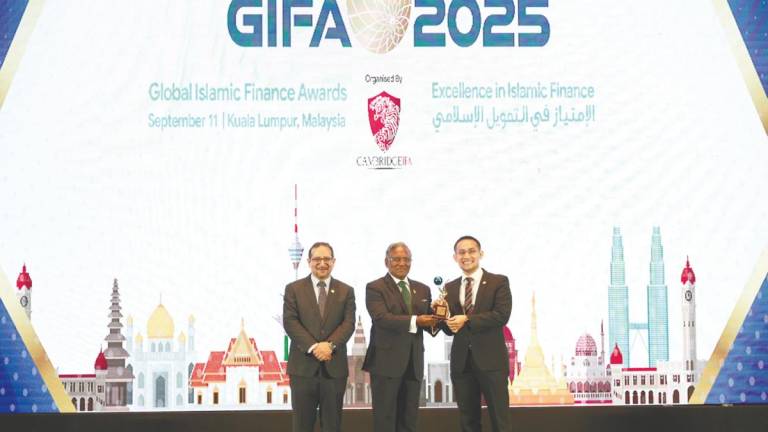 Asri (right) receiving the Best Takaful Company award at the Global Islamic Finance Awards 2025 ceremony.