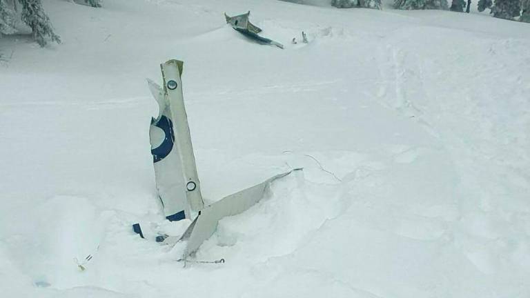 This photo taken on November 25, 2023 shows plane debris of a small plane that crashed at Kasberg Mountain, Gruenau im Almtal, Upper Austria. - AFPPIX