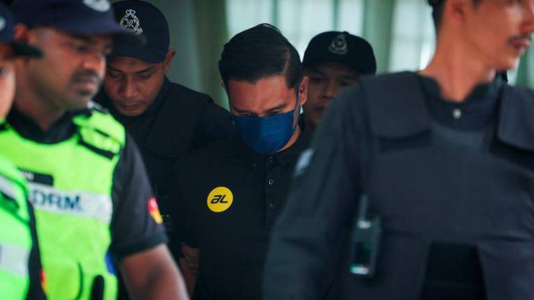 A police officer was charged in the Kuala Kubu Bharu Magistrate's Court today with the murder of Nur Farah Kartini Abdullah, whose body was found in a palm oil plantation. - BERNAMAPIX