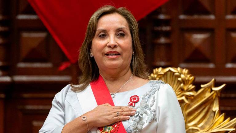(FILES) Peruvian President Dina Boluarte gestures upon her arrival to deliver her address to the nation on Independence Day at the National Congress in Lima on July 28, 2024. (Photo by Cris BOURONCLE / POOL / AFP)