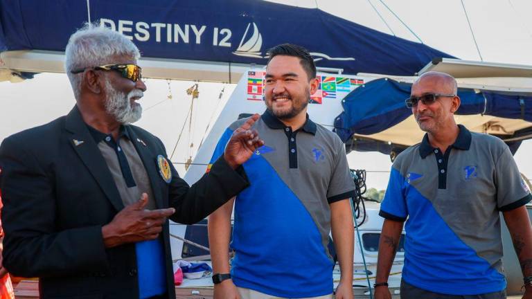 (From left) Royal Selangor Yacht Club Commodore Ramasamy Menon, Tengku Amir Shah and Fernandez at the yacht club during the homecoming ceremony for Destiny 12. – AMIRUL SYAFIQ /THESUN