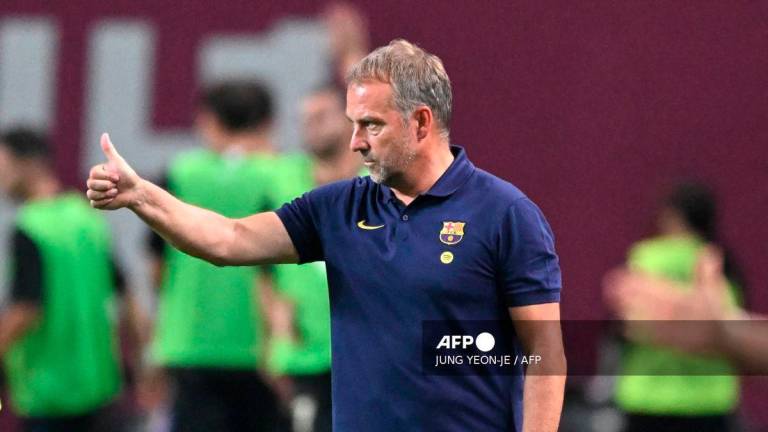 FC Barcelona's manager Hansi Flick gestures during the friendly football match between Spain's FC Barcelona and South Korea's FC Seoul in Seoul on July 31, 2025. - AFP