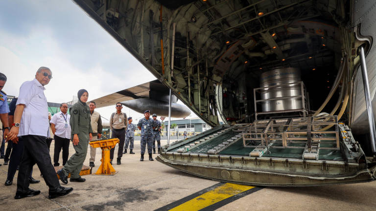 Deputy Prime Minister, Datuk Seri Dr Ahmad Zahid Hamidi, boards an aircraft at the Subang Air Base today to take part in the Cloud Seeding Operation (OPA) at the Bukit Merah Dam in Perak. – BERNAMA