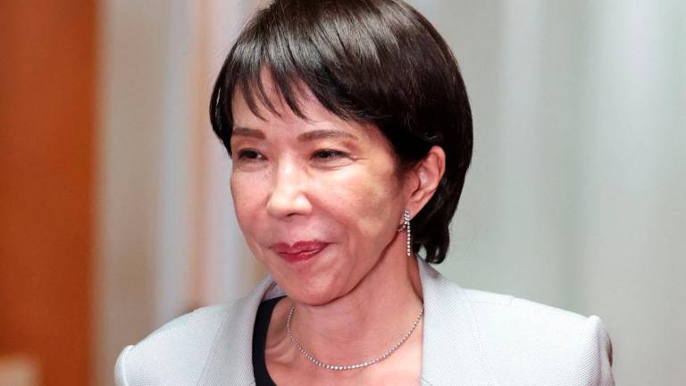 Leader of Japan's ruling Liberal Democratic Party (LDP) Sanae Takaichi leaves after a meeting with party members at its headquarters in Tokyo, Japan, October 16, 2025. - REUTERSPIX